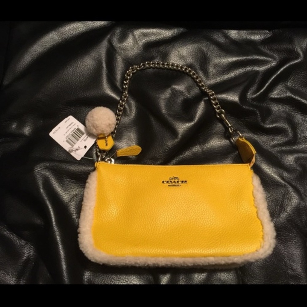 Coach leather bag with Pom Pom .
